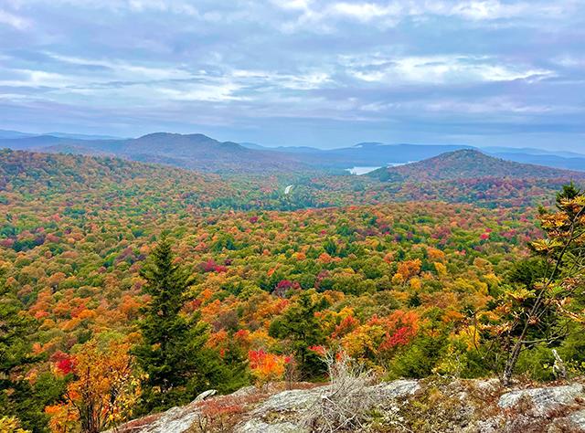 View of colorful fall foliage in the Adirondacks from Coney Mountain in Tupper Lake