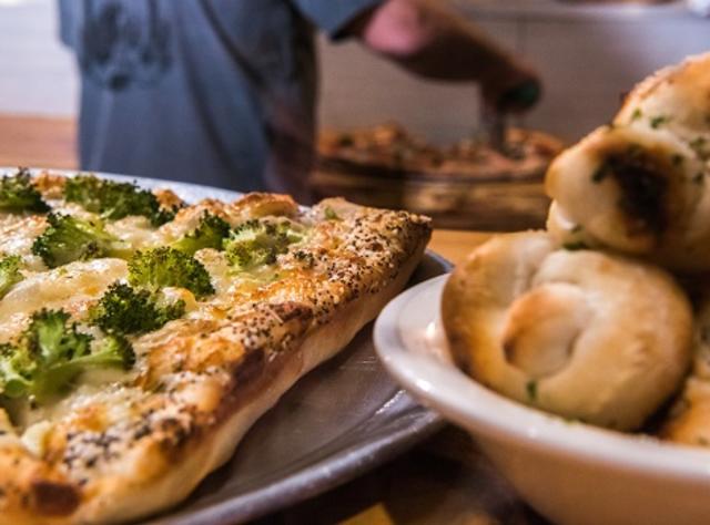 Broccoli topped pizza and garlic knots at Rip Van Winkle Brewing Company