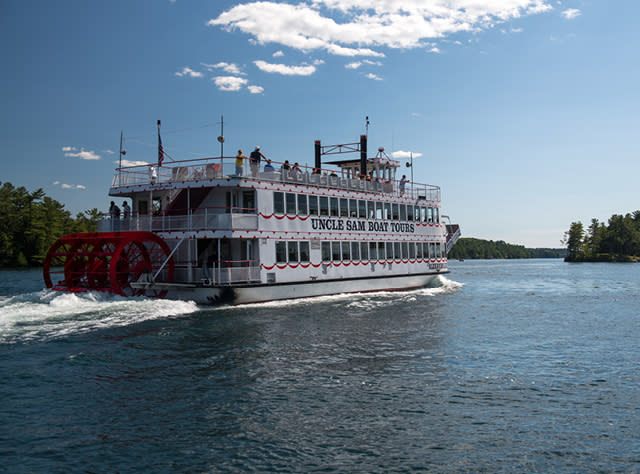 A picture of a white and red double-decker boat on the Uncle Sam Boat Tour