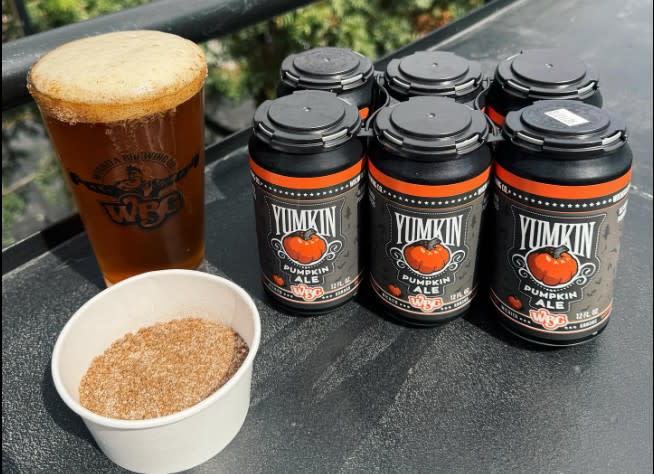 Yumpkin beer at Wichita Brewing Company is served next to  a six-pack.