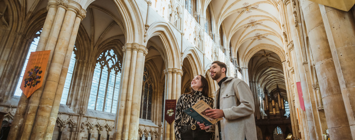 A couple marvel at the impressive interior of Beverley Minster in East Yorkshire