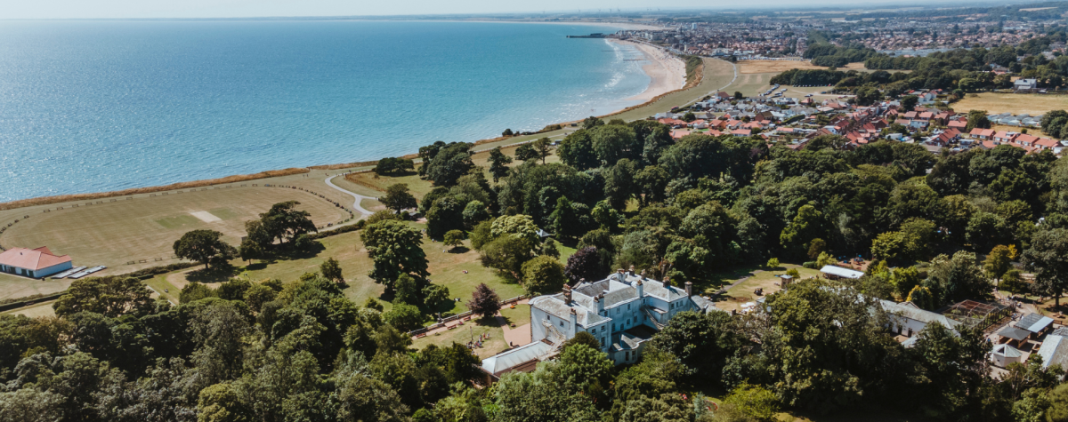 A bird's-eye view of the East Yorkshire coast, showing Sewerby Hall and the coastline stretching out into the distance