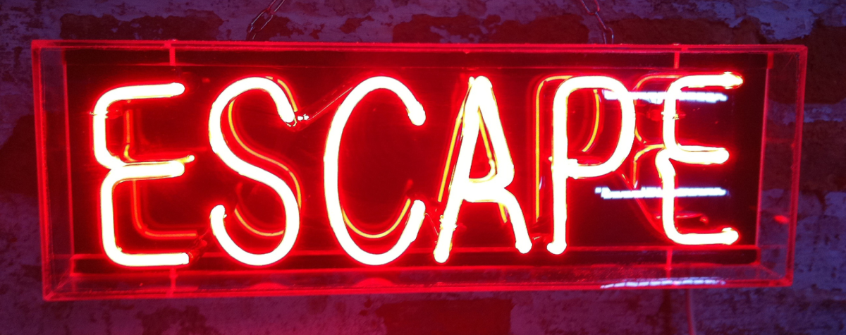 A neon sign showing the word escape