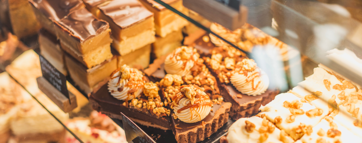 Cakes and tarts in the display cabinet at The Kitchen, Howden in East Yorkshire