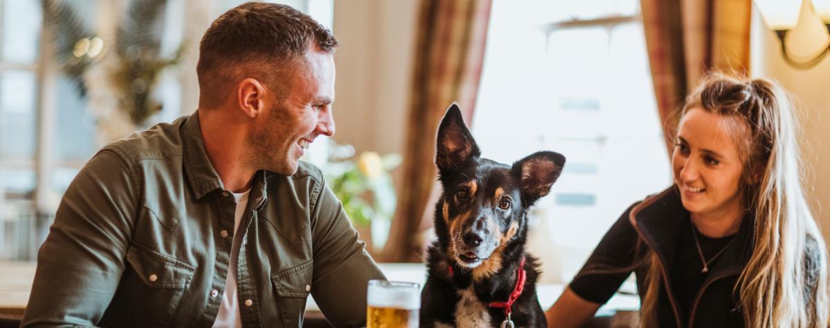 Couple with a dog sat in the Ship Inn, Sewerby