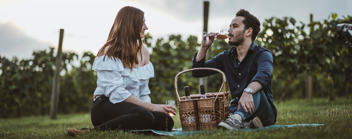 A couple enjoying a picnic at Little Wold Vineyard in East Yorkshire