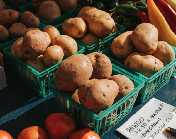 Baskets of potatoes on sale at a farmers market