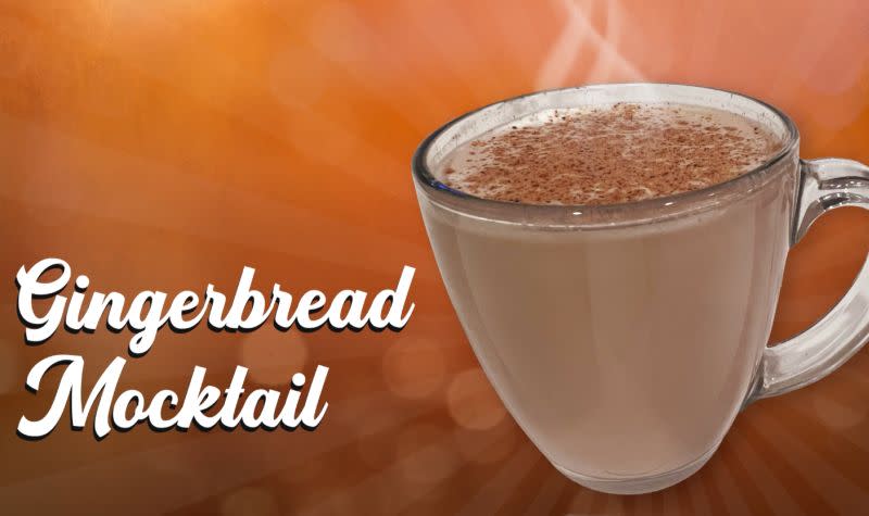 a glass mug with a steaming brown drink with cinnamon on top