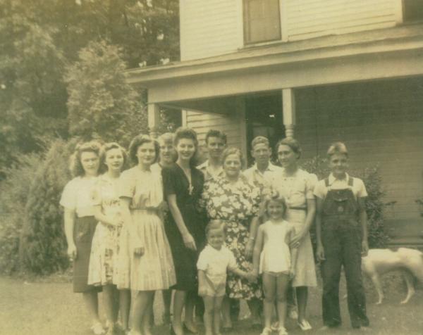 Ava with group of others in front of Rock Ridge Teacherage