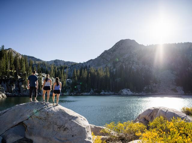 Friends hiking to a lake in Big Cottonwood Canyon