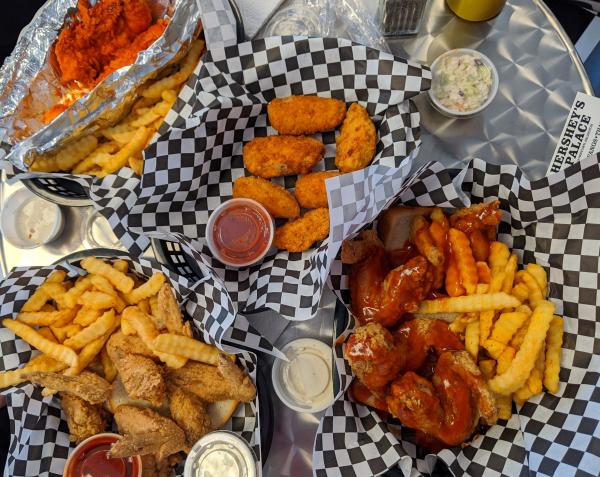 Photo of baskets of food with chicken wings and french fries