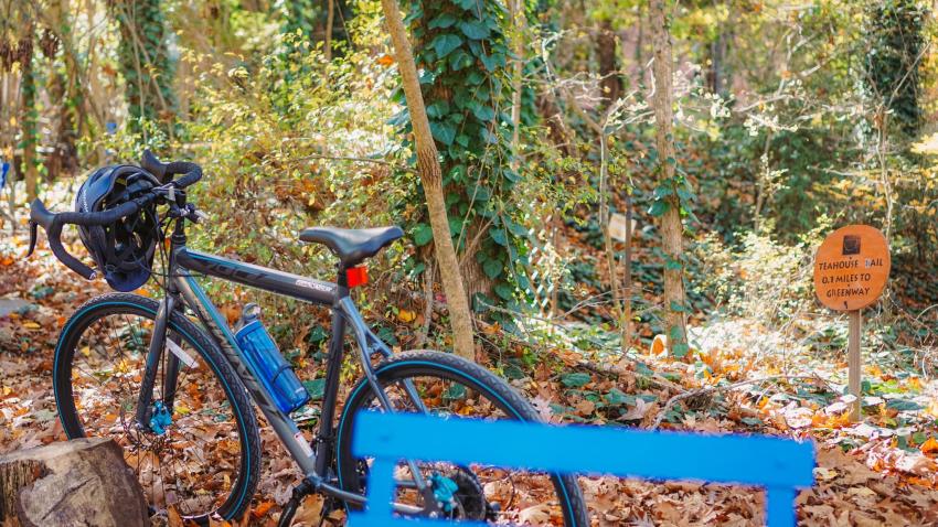 Bike on Bolin Creek Greenway Next to Teahouse Sign