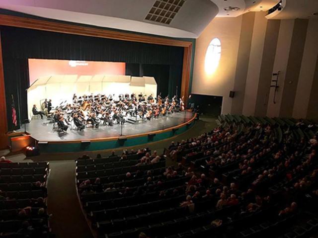 Indoor concert performance by symphony
