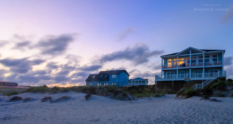 beachfront vacation rental homes after sunset on Oak Island, NC