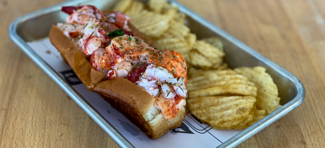 Lobster Roll and chips on a tray