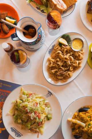 Columbia Restaurant table with appetizers and drinks and menu