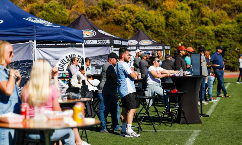 Group of people enjoying the hospitality areas at the Oakland Roots games