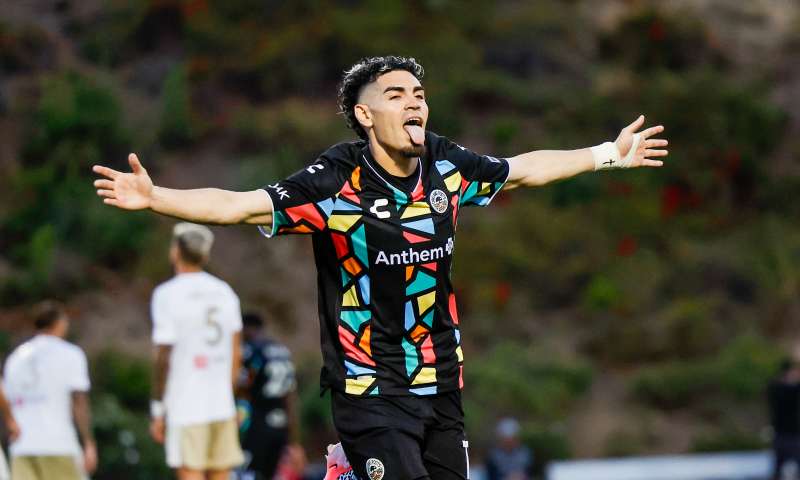Oakland Roots soccer celebrating after scoring a goal