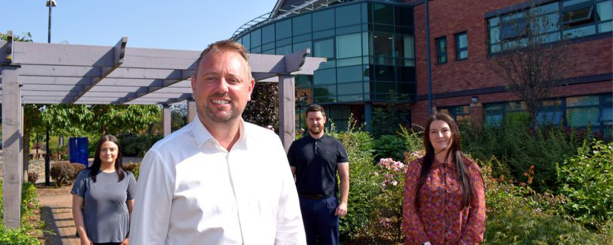 Water Plus chief executive Andy Hughes with Water Plus staff