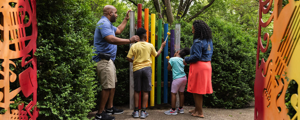 A family explores the children's garden at Botanica Wichita.