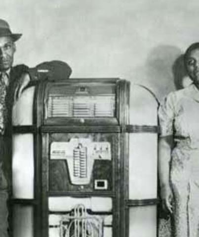 Lola and an unidentified man stand by the jukebox at the Black and Tan Cafe in Cheyenne Wyoming