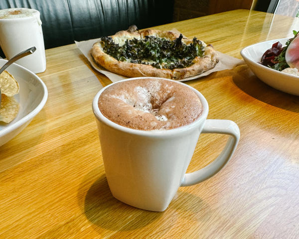 A mug of Northstar Hot Chocolate on a table