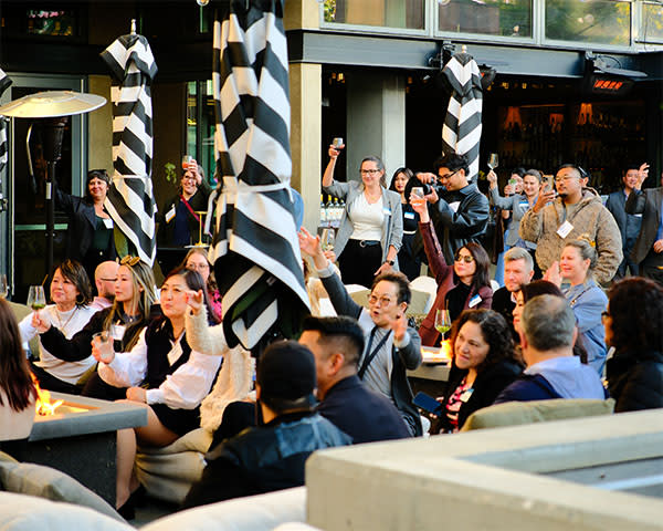 Group of people enjoying drinks at Flavors of the Peninsula 2026 Industry Preview event