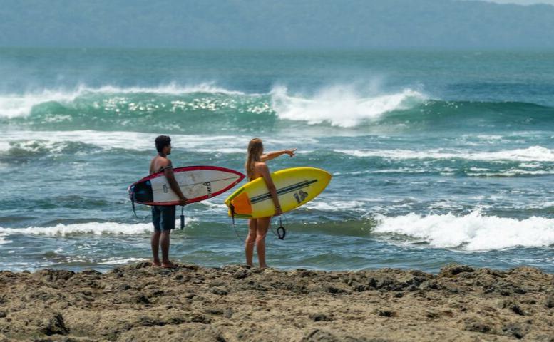 Couple Surfing on Santa Catalina Beach