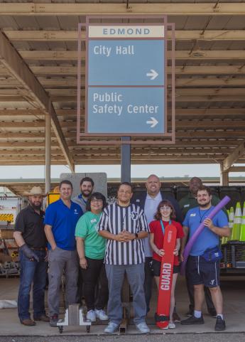 Edmond staff with wayfinding sign