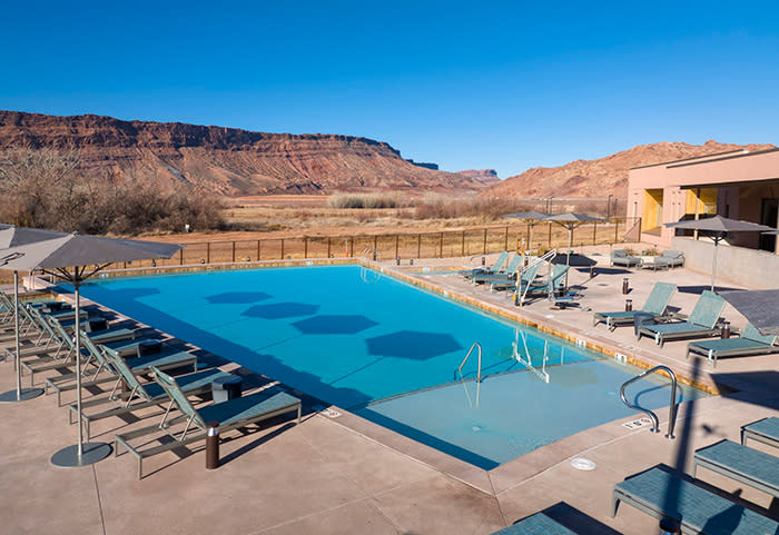 The WorldMark Moab Resort pool surrounded by Moab’s red rock and desert.