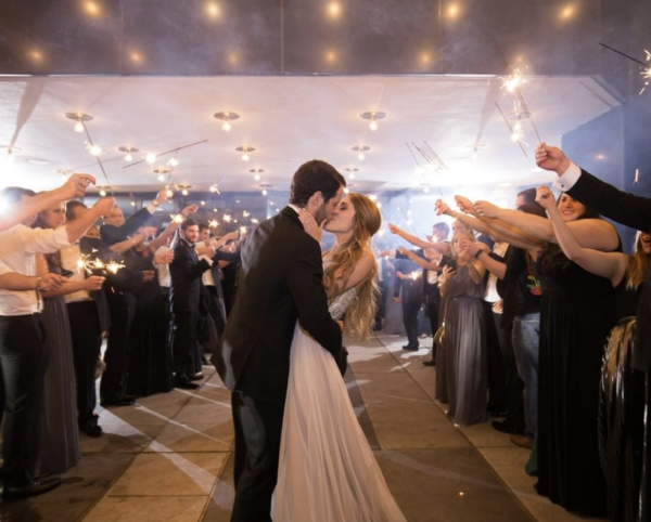 Bride and Groom Kiss At The Four Seasons In Houston, TX