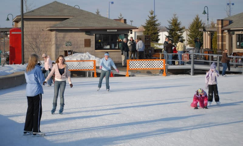People ice skating at a rink