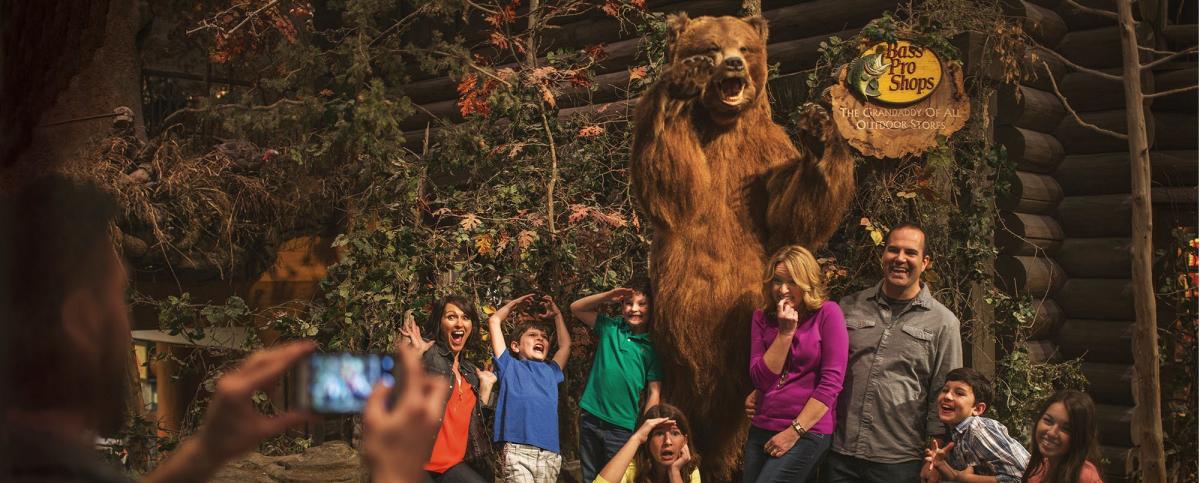 A family poses for a photo in Bass Pro Shops in Springfield, Missouri