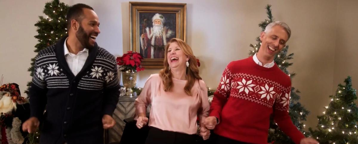 Cast members dressed in Christmas sweaters laugh as they perform in Music Theatre Wichita's Holiday Special