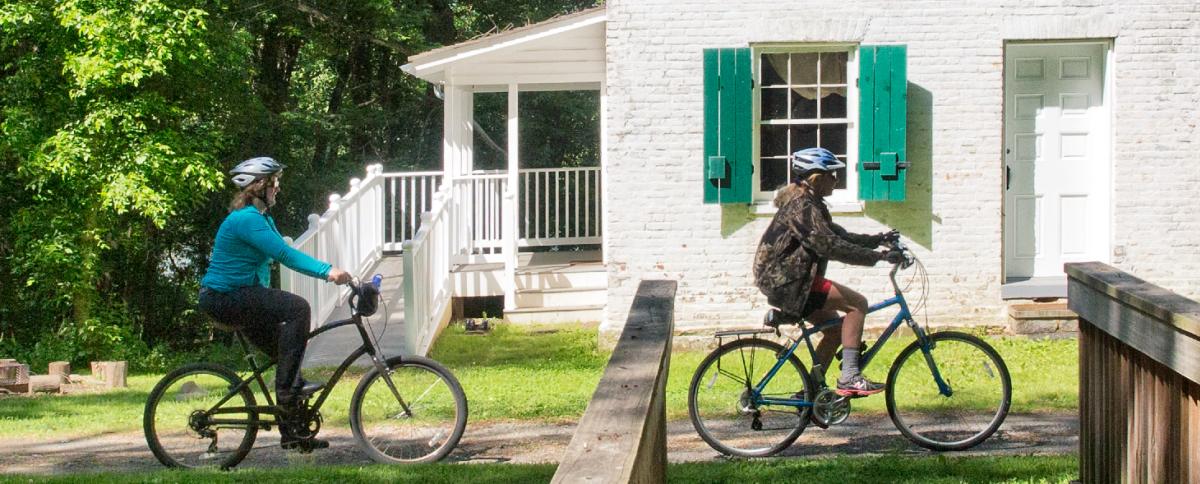 Two people riding their bikes in Frederick, MD