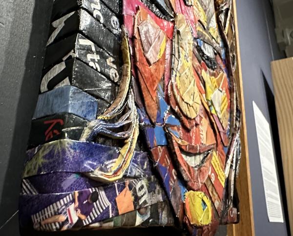 “Face 4 — Christmann” by Brazilian-born artist Eloa Jane Pereira on recycled paper is on display at the Fort Smith Regional Art Museum in Fort Smith, Arkansas.