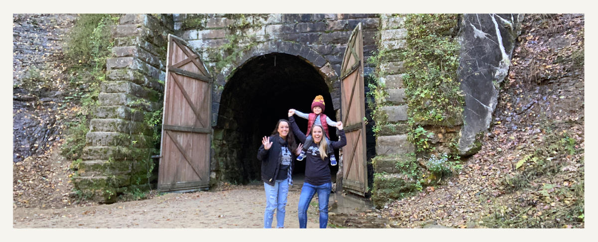 Family Standing In Front Of Elroy-Sparta State Trail Tunnel 3 in Sparta, WI