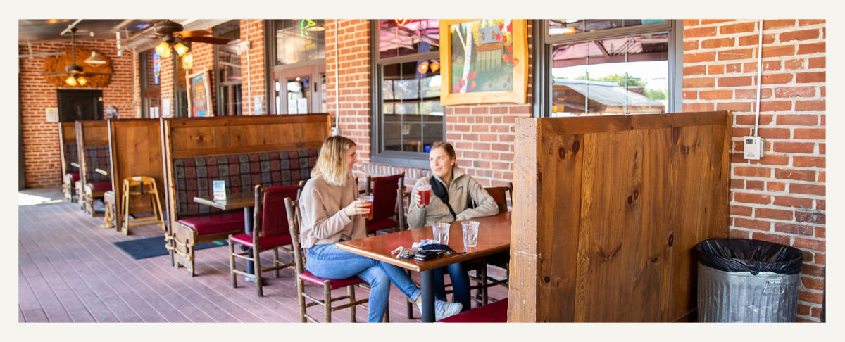 Two Women Having A Beer At Northwoods Brewpub in Osseo, WI