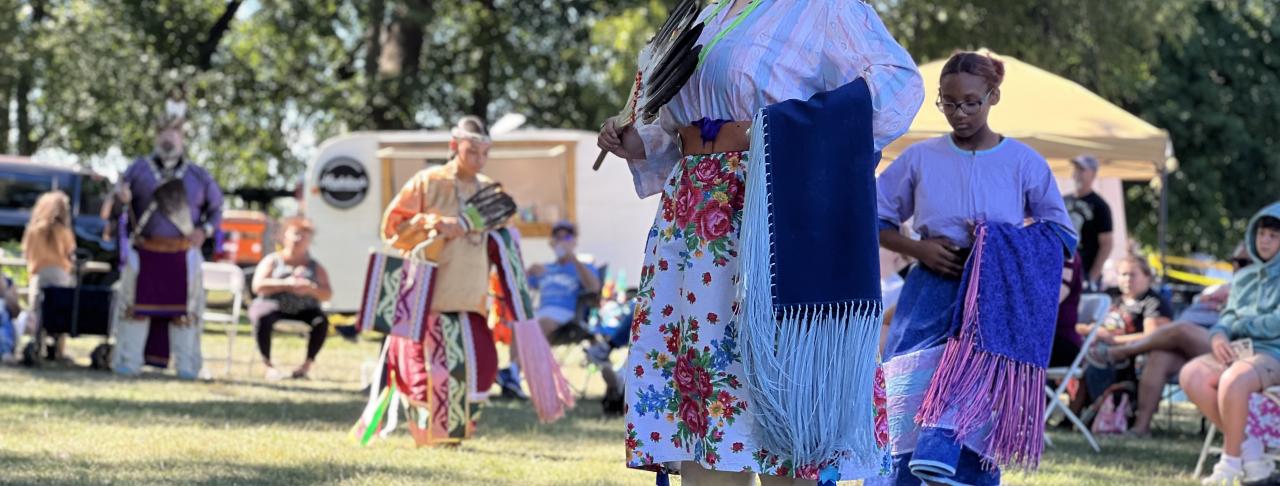 Native American women performing a dance at the Kipona Festival
