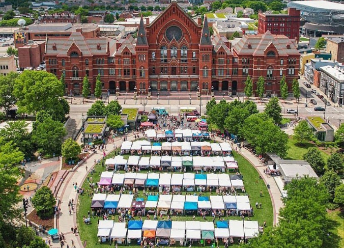 Aireal view of Washington Park and Music Hall with tents lined up to sell goods.