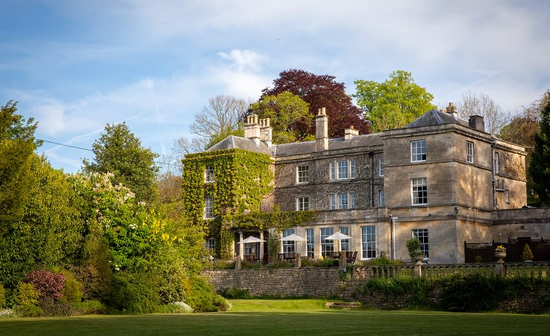 Burleigh Court manor house surrounded by lush grounds