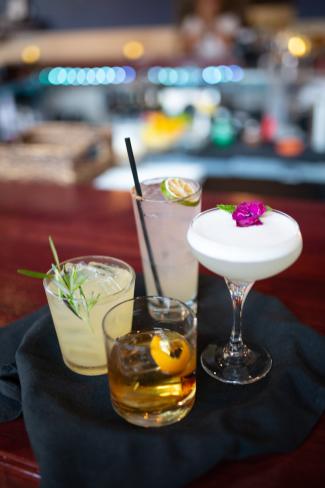 Four Urban Grill cocktails on a table