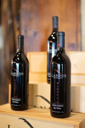 Landon wine - three bottles of wine standing on a table