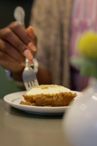 a hand holding a fork ready to eat a piece of pie