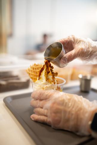 Miruku - hands pouring coffee over ice cream