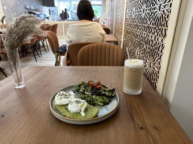 Avocado Toast and an iced coffee inside Maison Skalli