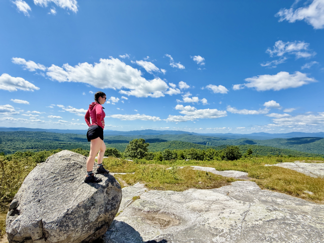 Foss Mountain View - Hiker Standing on Boulder Looking At Scenery