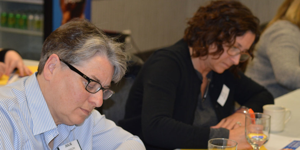 Two women diligently taking notes during the March 2018 Industry Insider Training event