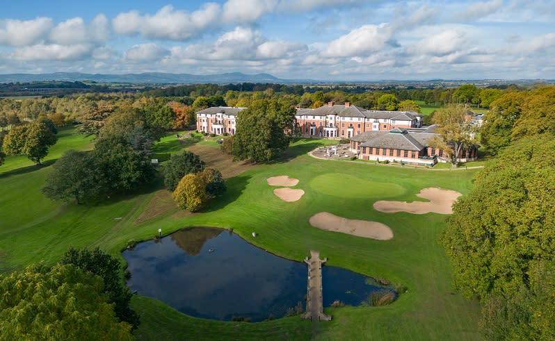 The Hilton Puckrup Hotel set amongst tree covered grounds