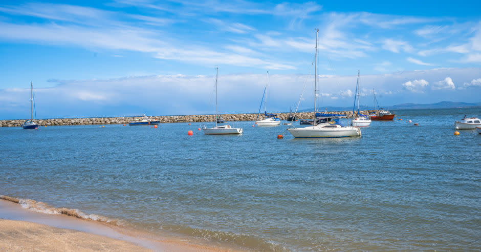 View of boats on the water at Rhos-on-Sea